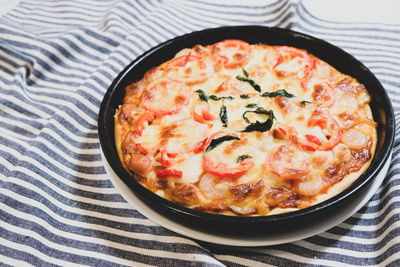 High angle view of pizza in bowl on table