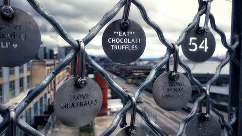 Close-up of padlocks hanging on heart shape