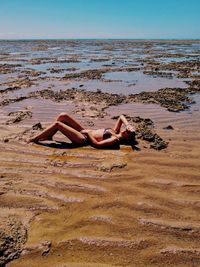 Woman lying at beach