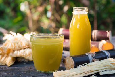 Close-up of sugar cane juices on table