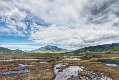 View of lake against cloudy sky