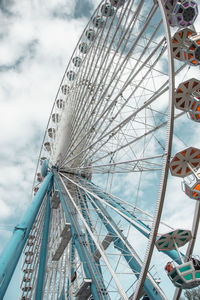 Low angle view of ferris wheel against sky