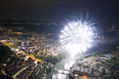 High angle view of firework display over city street