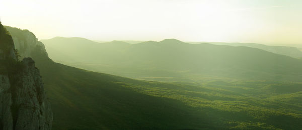 A landscape with foggy mountains silhouettes at morning sunrise. crimean peninsula, sidam qaya
