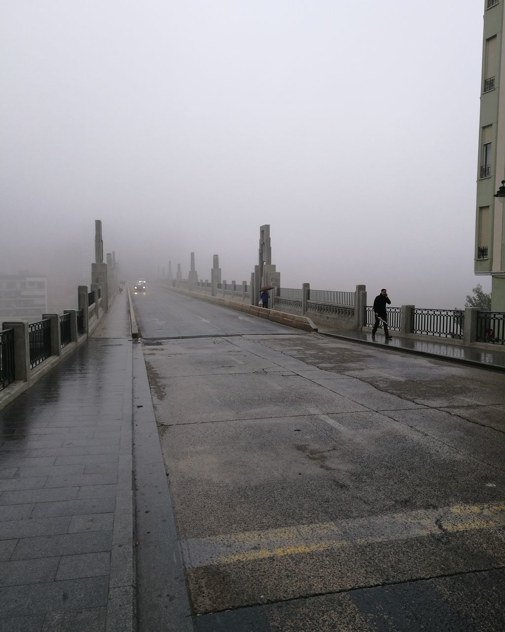 built structure, architecture, transportation, building exterior, outdoors, fog, no people, day, the way forward, sky, city, nature