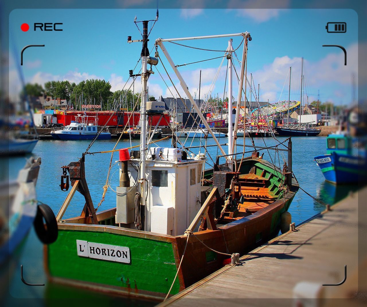 nautical vessel, transportation, mode of transport, boat, moored, water, mast, harbor, sea, sky, text, communication, sailboat, travel, commercial dock, waterfront, day, river, western script, outdoors