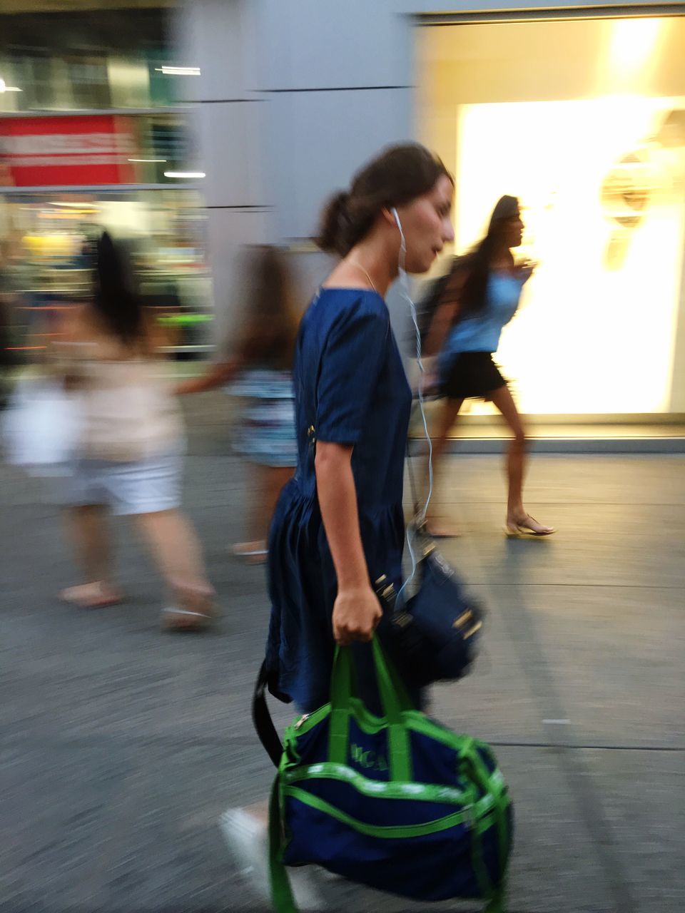 BLURRED MOTION OF MAN WALKING ON STREET