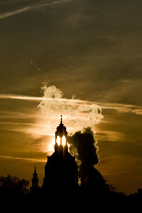 Low angle view of silhouette man against sky during sunset