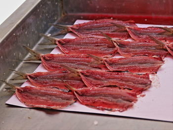 Close-up of anchovies in row