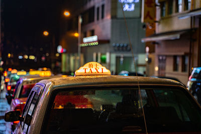 Illuminated city street at night