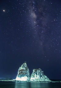 Scenic view of sea against sky at night