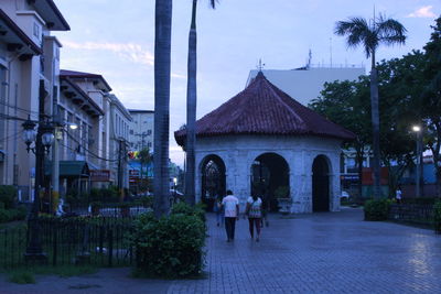 People walking in front of building