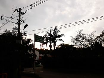 Low angle view of electricity pylon against sky