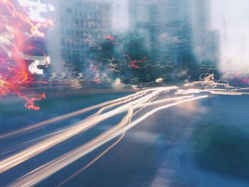 Blurred motion of light trails on road at night