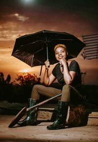 Portrait of smiling woman sitting outdoors