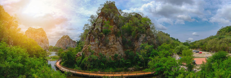 Panoramic shot of trees on landscape against sky