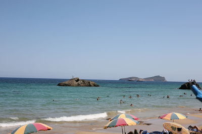 Scenic view of beach against clear sky