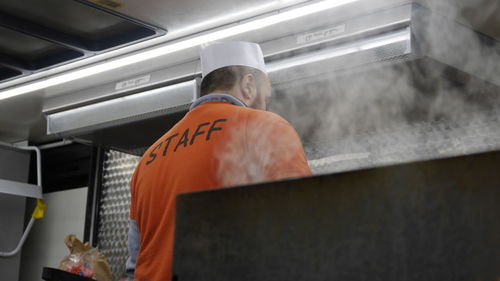 Low angle view of man working in commercial kitchen