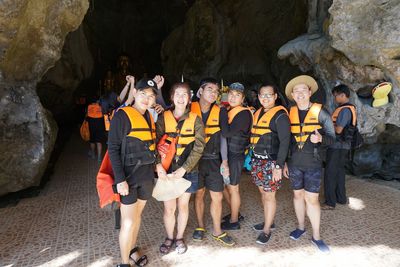 Group of people standing on rock