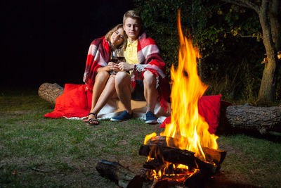 Young couple sitting in park