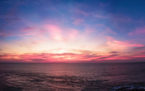 Scenic view of sea against sky at sunset