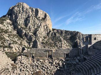 Panoramic view of buildings and mountain against sky