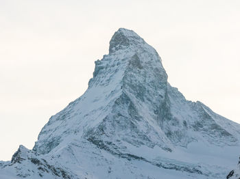 Scenic view of snowcapped mountain against clear sky