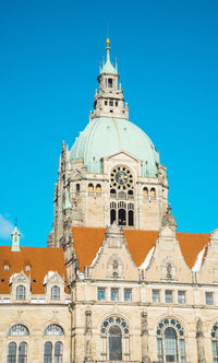 Low angle view of building against blue sky