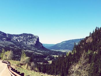 Scenic view of mountains against clear blue sky