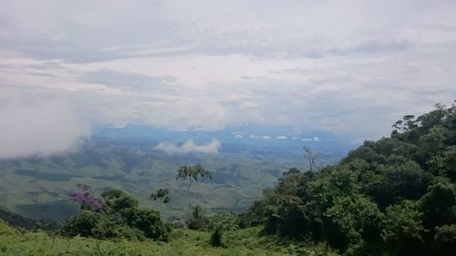 Scenic view of landscape against cloudy sky