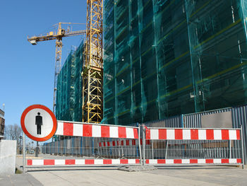 Barriers with no access sign restricting access to construction site by unauthorized persons