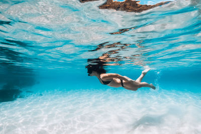 Man swimming in sea