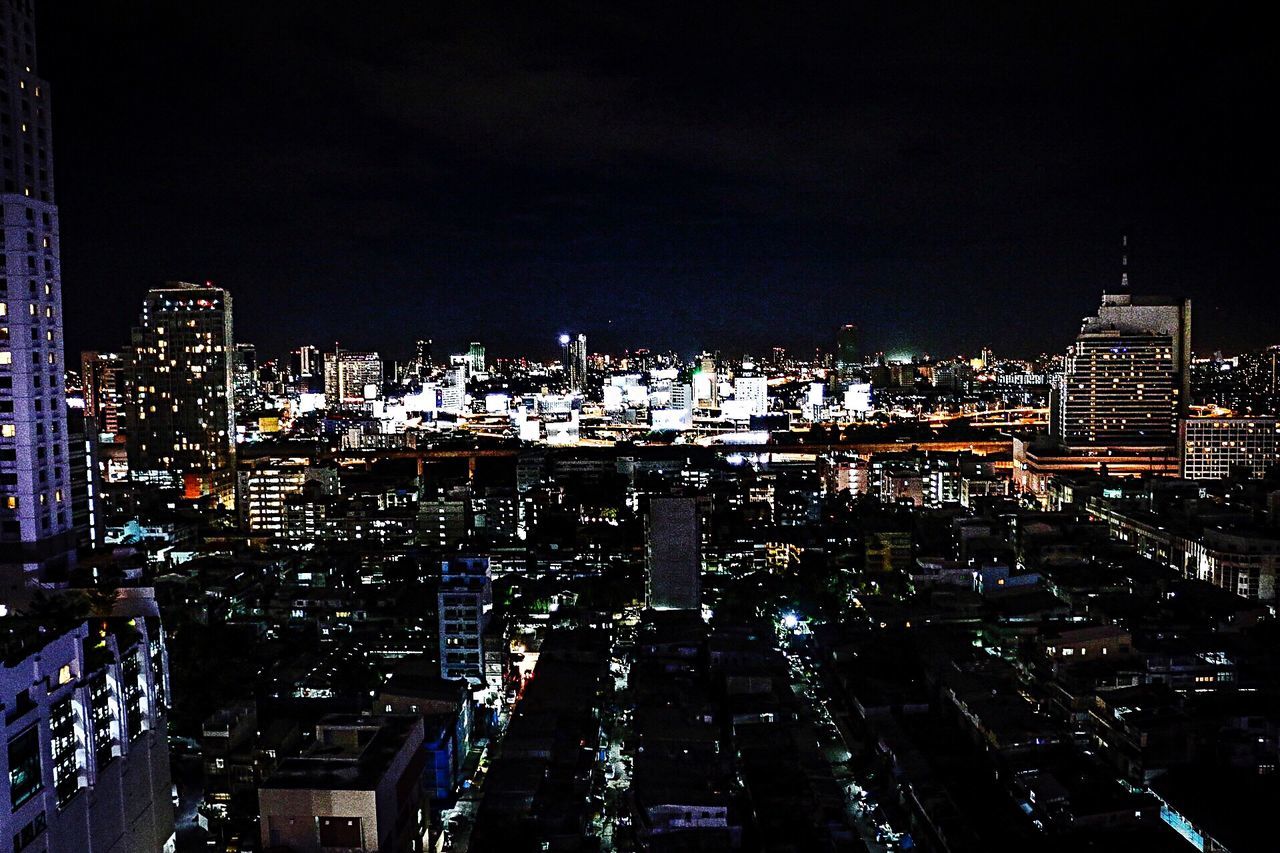 building exterior, city, cityscape, architecture, illuminated, night, built structure, crowded, high angle view, residential district, skyscraper, residential building, city life, residential structure, sky, office building, tall - high, tower, modern, no people