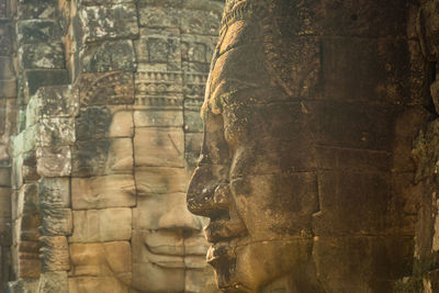 Faces of king yayavarmann vii on the beautiful bayon temple, angkor wat, cambodia