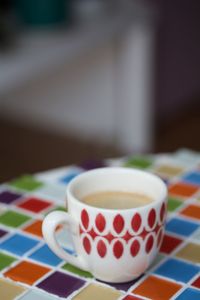 Close-up of coffee cup on table