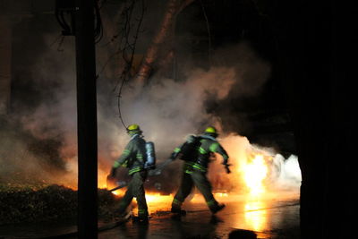 Firefighters at work during night