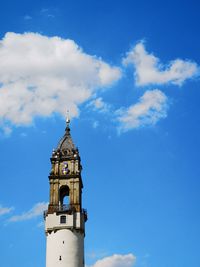 Low angle view of lighthouse and building against sky