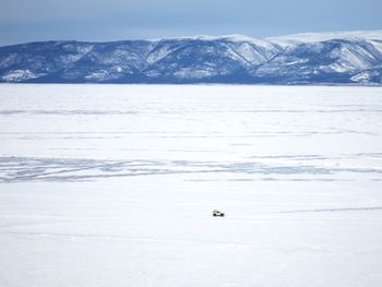 Scenic view of frozen lake against sky