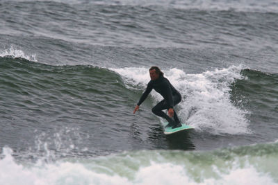 Full length of man surfing in sea