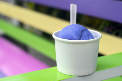 Close-up of ice cream cup on table