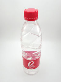 Close-up of red glass bottle against white background