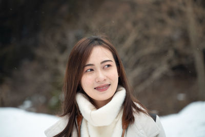 Portrait of a beautiful young woman in winter