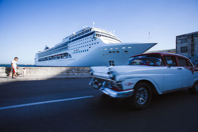 Cars on road against sky