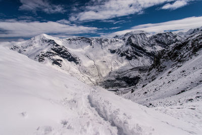 Scenic view of snowcapped mountains against sky