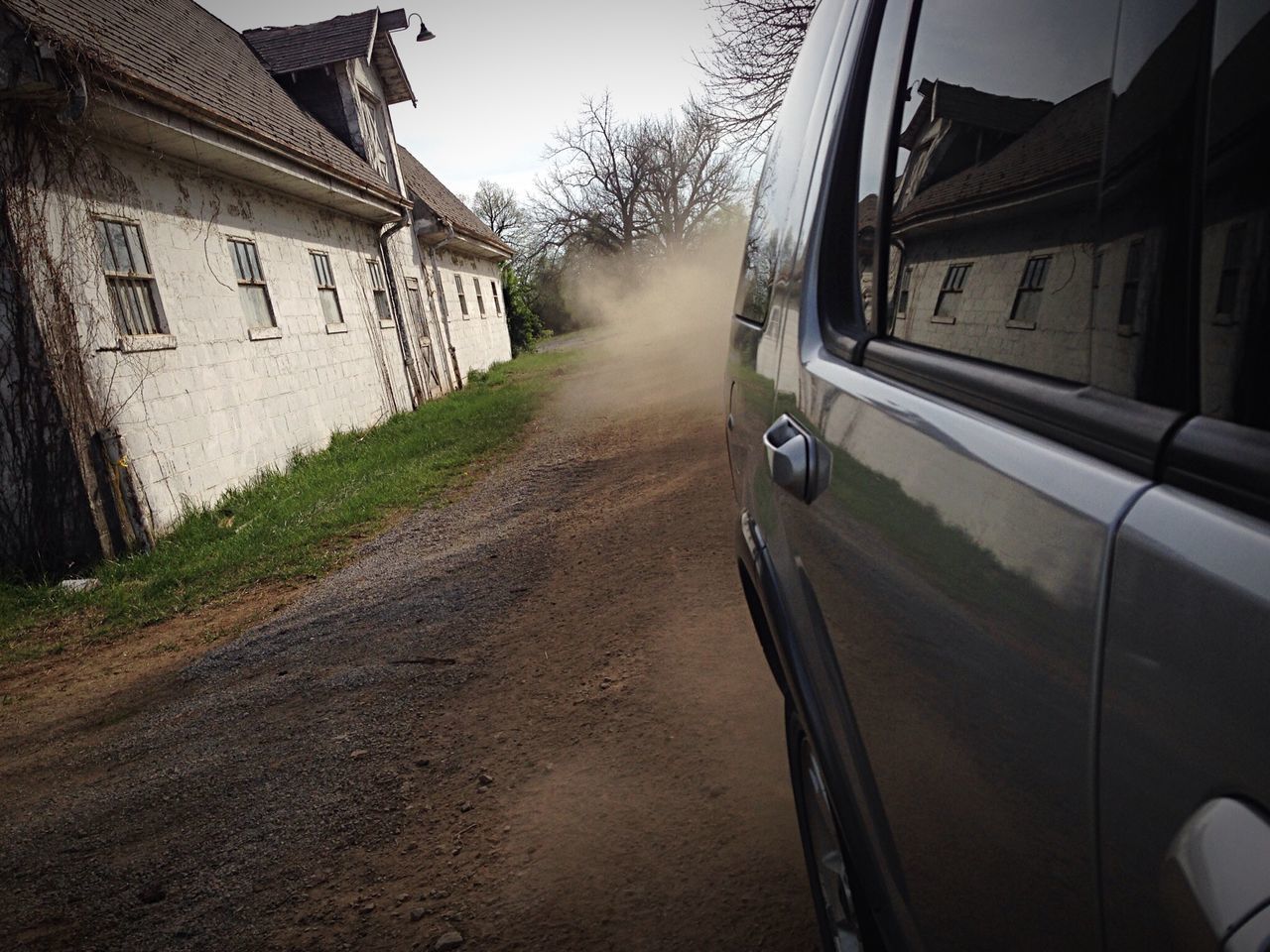 transportation, building exterior, land vehicle, architecture, mode of transport, built structure, car, street, road, the way forward, building, diminishing perspective, outdoors, day, city, house, travel, no people, stationary, vanishing point