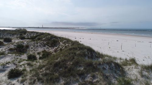 Scenic view of beach against sky