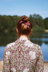 Rear view of young woman alone in nature