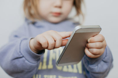 Midsection of woman using mobile phone