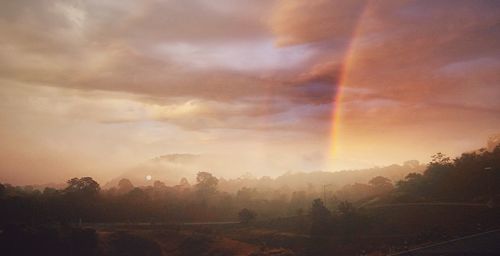 Scenic view of rainbow against sky during sunset