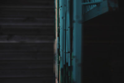 Close-up of metal railing against wall